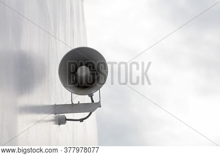 White Megaphone, Loud Speaker Close-up. Hanging On The Wall. High Quality Photo