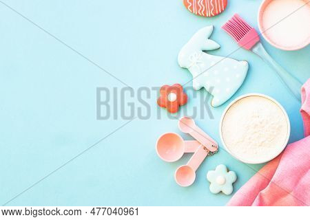 Easter Baking, Flour, Edds, Sugar And Gingerbread Cookies. Top View On Blue.