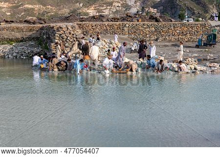 Swat Valley, Pakistan - May 05, 2023: Unknown People Washing And Looking For Emeralds In The Gravels