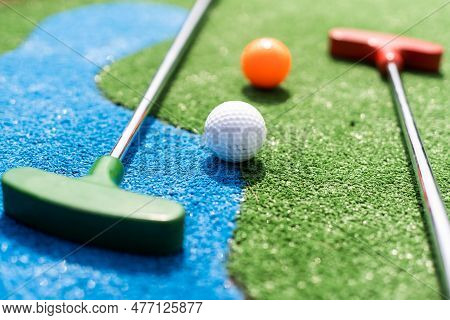 Mini-golf Ball On Artificial Grass. Summer Season Game