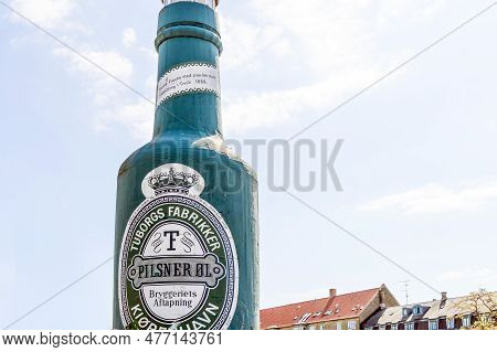 Big Green Bottle Of Tuborg Beer Monument In Copenhagen, Denmark - June 1, 2023.