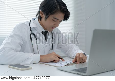 Telemedical. Doctors Are Read Record Of Patients An Interview Video Conference. Asian Doctor Is Trea