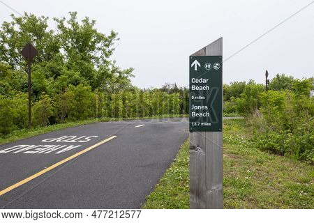 Sign Post Showing The Milage On A Bike Path To Jones Beach From Captree State Park On The South Shor