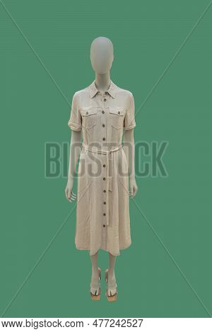 Full Length Image Of A Female Display Mannequin Wearing Trendy Shirtdress With Belt Isolated On Gree