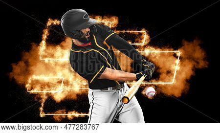 Baseball Player With Bat Taking A Swing On Grand Arena. Ballplayer On Dark Background In Action.