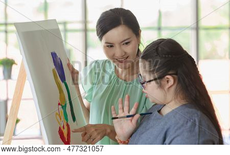 Close Up Shot Of Asian Happy Lovely Mother Face Standing Smiling Encouraging Young Chubby Down Syndr