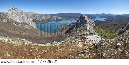 Picturesque Reservoir And Mountain Panoramic Landscape In Riano. Hikkers. Spain