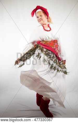 Portrait Of A Cheerful Funny Adult Mature Woman Solokha. Female Model In Clothes Of National Ethnic 