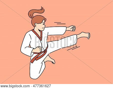 Woman In Kimono Exercising Karate On Ring. Strong Powerful Girl In Special Uniform Practice Martial 