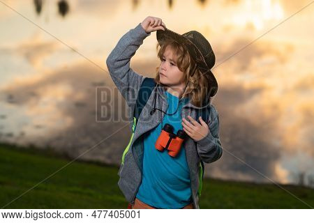 Scout Boy Wearing Explorer Hat And Backpack Outdoor. Explorer And Adventure With Binocular.