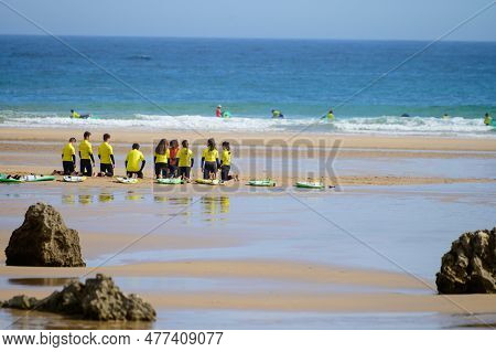 Young Surfers Train On Playa De Palombina Las Camaras In Celorio, Green Coast Of Asturias, North Spa