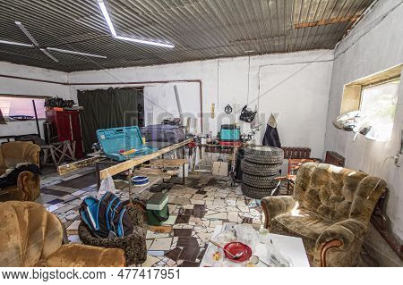 Big Mess In An Over Stuffed Suburban Garage
