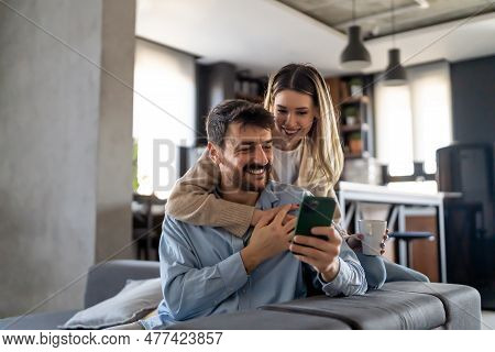 Capturing Happy Moments Together. Happy Young Loving Couple Making Selfie And Smiling.