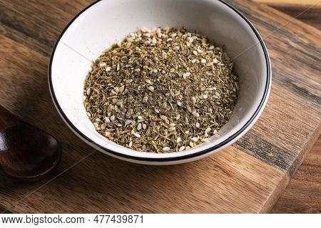 Mixed Zaatar Or Zatar Spices In White Bowl Close Up. Oriental Herbal Seasoning Zaatar Or Zattar. Ara