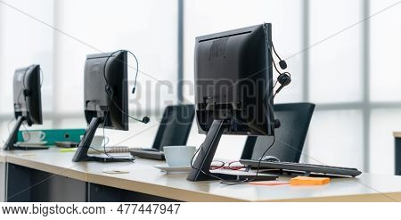 Call Center Computers And Headsets All In Office. Telemarketing, Customer Support Agent Provide Serv