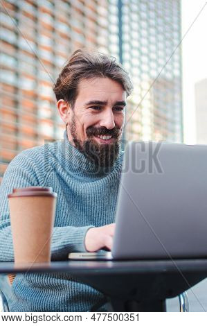 Vertical Portrait Of Young Successful Man Remote Working From Coffee Terrace And Having Work Confren