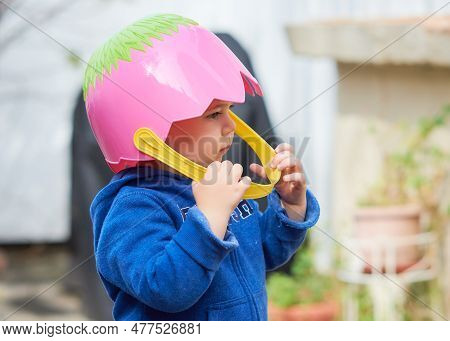 Adorable Baby With An Easter Basket For A Helmet