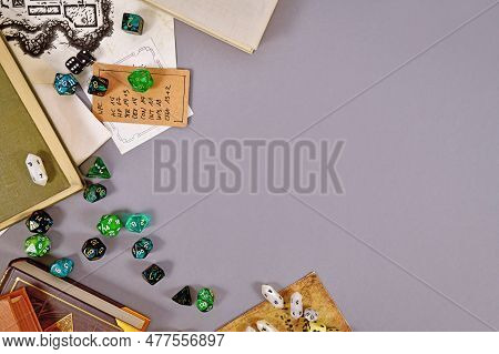 Tabletop Roleplaying Flat Lay With Rpg And Game Dices, Rule Book, Notes And Treasuremap On Gray Back