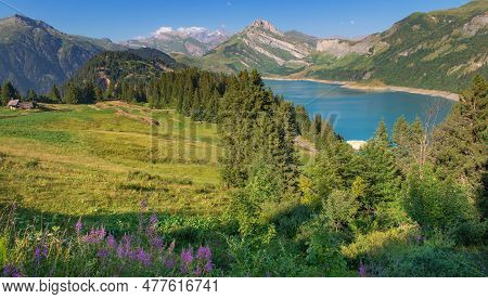 Beautiful Scenic Landscape With  Blue Water Of  Roselend Dam And Peak Montain Back In Green Meadow I