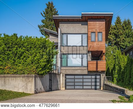 Real Estate Exterior Front House On A Sunny Day. Big Custom Made Luxury House With Nicely Landscaped