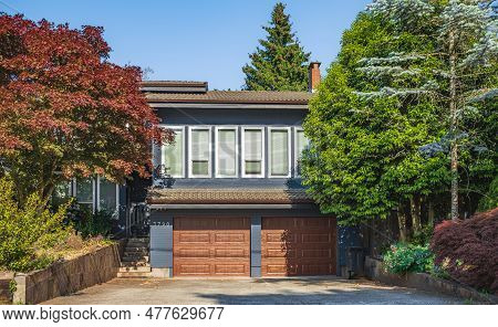 Real Estate Exterior Front House On A Sunny Day. Big Custom Made Luxury House With Nicely Landscaped
