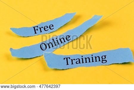 Free Online Training Text On Blue Pieces Of Paper On Yellow Background, Business Concept