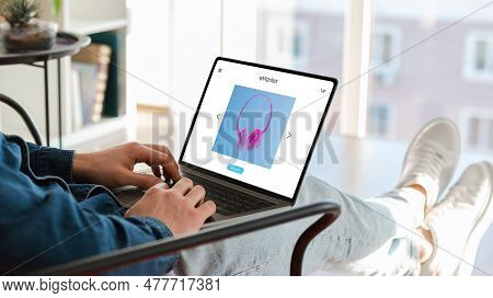 Man Using Pc Laptop With Hardware Store On Screen, Sitting On Puff Chair With Computer, Order New He