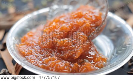 Famous Indian Dessert Sweet Dish In A Glass Bowl On A Jute Bag's Surface I.e. Murabba Or Murba Along