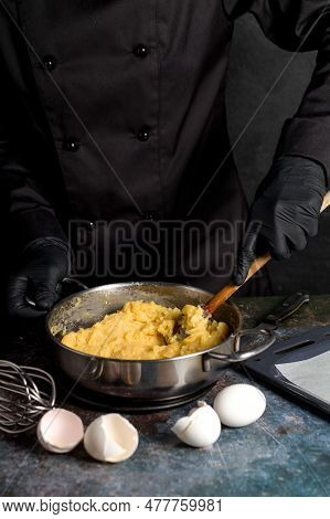 Preparation Of Custard Dough For Profiteroles, Eclairs. The Process Of Making Profiteroles