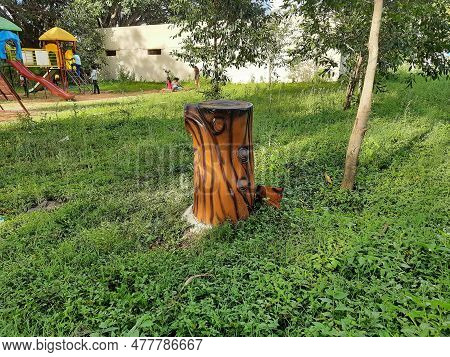 Beautiful Wooden Stem Shape And Monkey Shape Collecting Wastes On Park