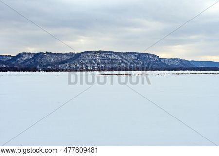 The Frozen Mississippi River Under Frozen Bluffs In The Trempealeau National Wilddlife Refuge In Wis