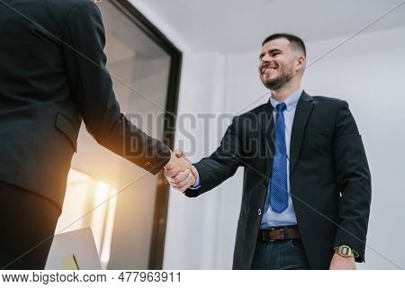 Business People Shaking Hands In Office. Collaborative Teamwork. Concept Of Successful Business Peop