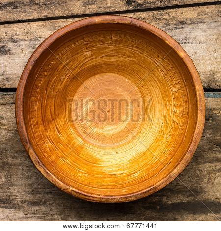 Ceramic Bowl On Wood Background. Top View