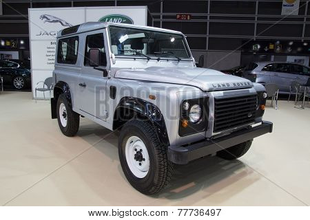 VALENCIA, SPAIN - DECEMBER 4, 2014: A silver 2013 Land Rover Defender at the Valencia Automovil 2014 Car Show. Production of the Defender model began in 1983.