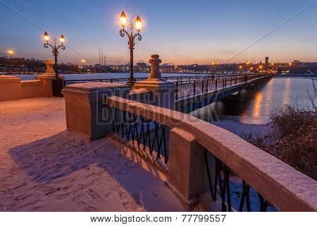 Bridge city landscape in snowy winter night
