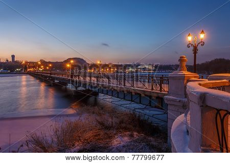 Bridge city landscape in snowy winter night