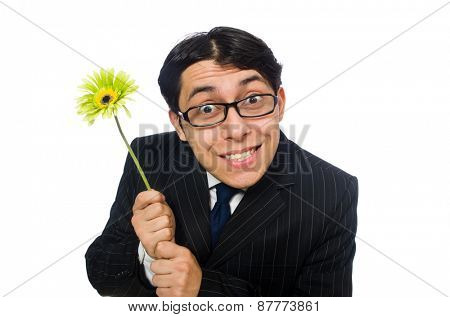 Young man in black costume with flower isolated on white