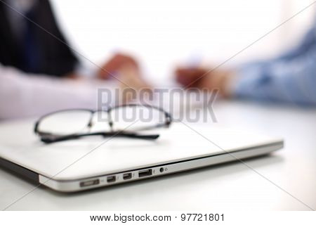 Medical doctor  sitting at table and looking patients roentgen