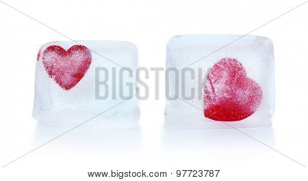 Red hearts in ice cubes isolated on white