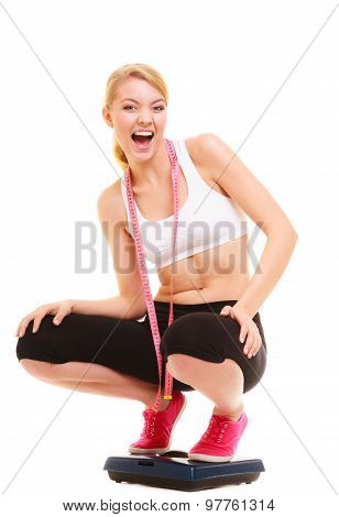 Happy Woman On Weighing Scale. Healthy Lifestyle.