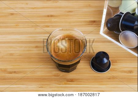 Top view of espresso and coffee capsules on wooden background. Different coffee pod machines.Copy space.