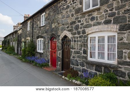 Bala Wales UK - May 3 2017: A row of traditional stone built terraced cottages in Wales typical of 19th century miners or rural workers housing now generally used for holiday or starter homes