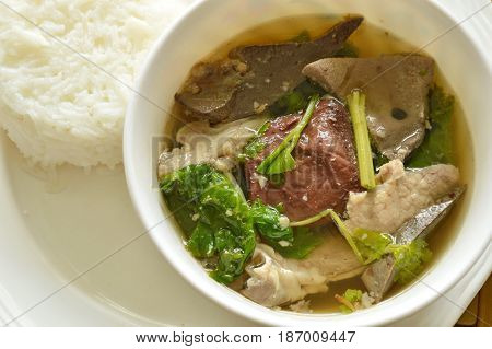 boiled pork blood and entrails soup eat couple with rice on plate