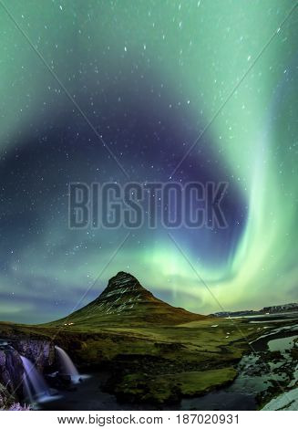 Northern Light Aurora borealis at Kirkjufell Iceland with fully start in the sky