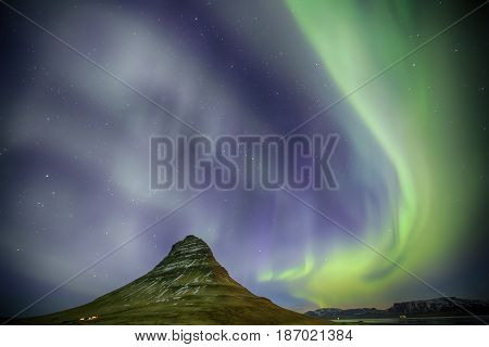 Northern Light Aurora Borealis At Kirkjufell Iceland With Fully Start In The Sky
