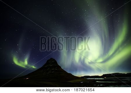 Northern Light Aurora Borealis At Kirkjufell Iceland With Fully Start In The Sky