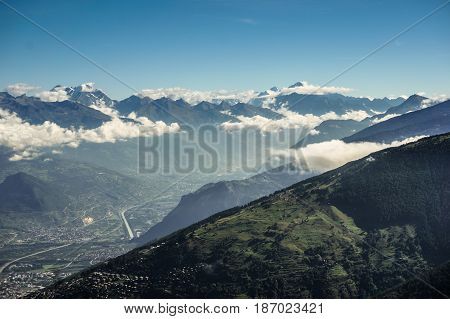 Cloud beside mountain with blue sky in Nendaz Switzerland.