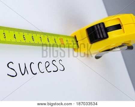 Success measuring aspirations tape measure concept isolated measure of success