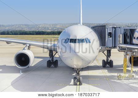 Airplane ready for boarding in a airport hub. Airplane ready for pushback in a airport hub.