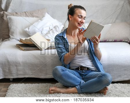 Girl Reading A Book In A Cozy Room